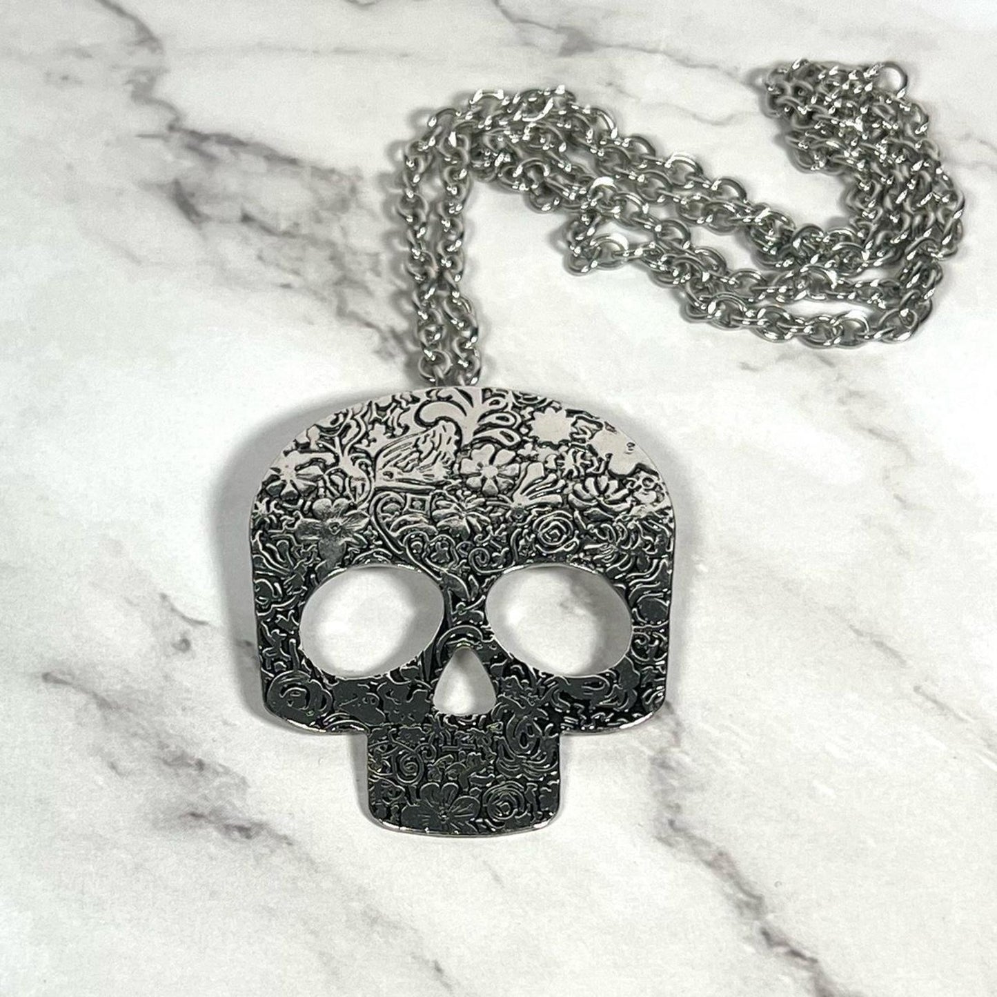 Black and silver sugar skull necklace with a grunge vibe