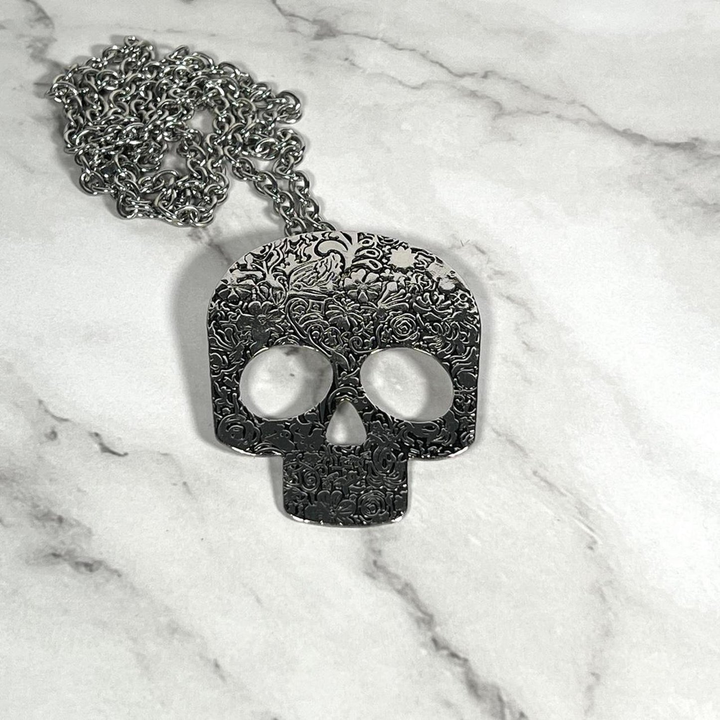 Black and silver sugar skull necklace with a grunge vibe